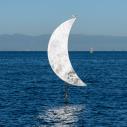 Moon sculpture with bird